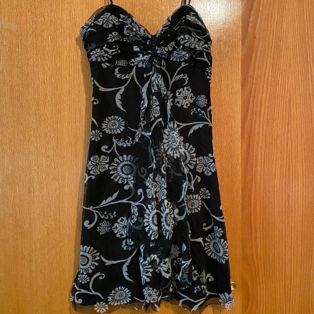 Fun floral dress with spaghetti straps. Flows fabric. Flattering design